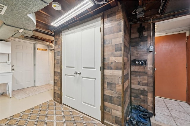 1417 Riverview Dr, Verona, PA 15147 - unfinished below grade area with light tile patterned floors and wooden walls