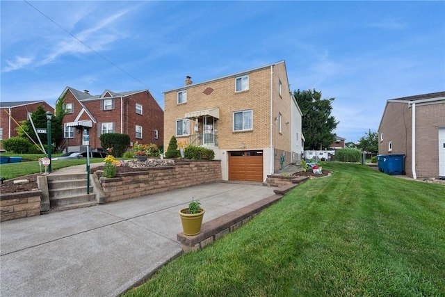 1417 Riverview Dr, Verona, PA 15147 - rear view of house featuring concrete driveway, a garage, a lawn, and brick siding