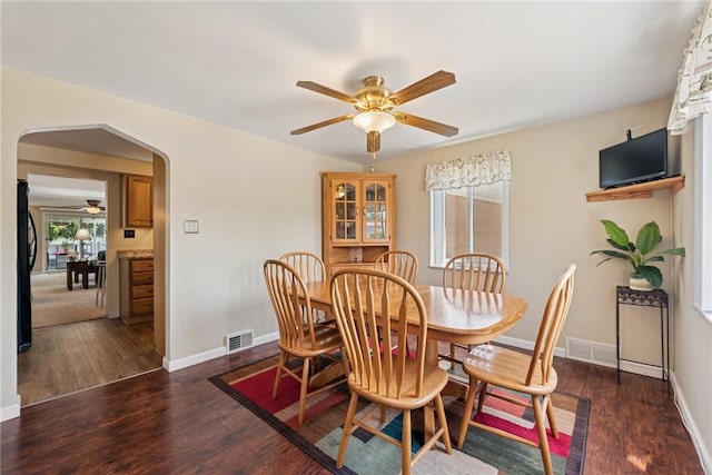 1417 Riverview Dr, Verona, PA 15147 - dining room with arched walkways, a ceiling fan, and wood finished floors