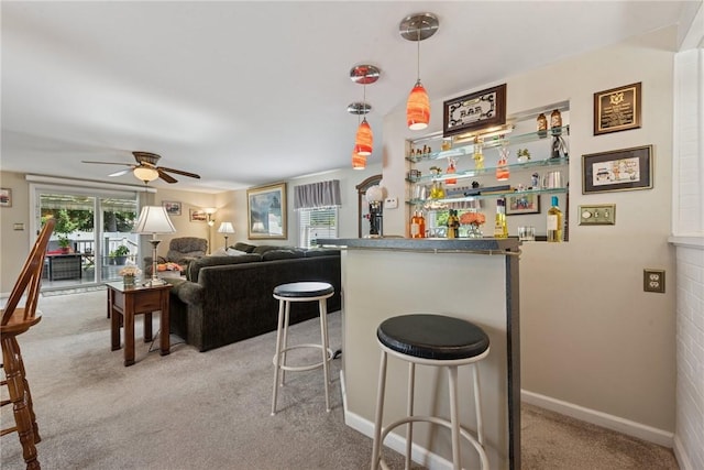 1417 Riverview Dr, Verona, PA 15147 - indoor dry bar with carpet flooring, a ceiling fan, and decorative light fixtures