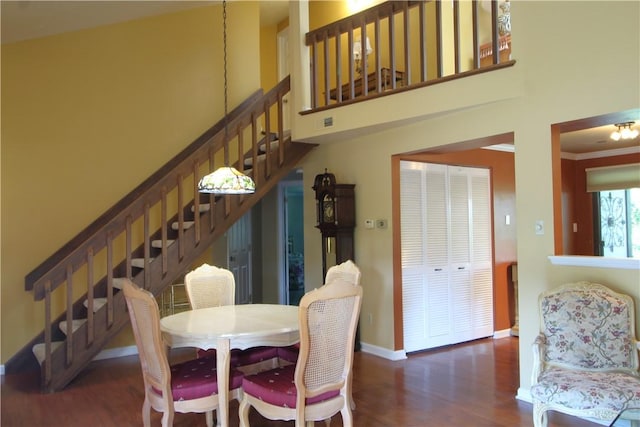 104 Victoria Dr, North Strabane, PA 15317 - dining room with wood finished floors, ornamental molding, stairs, and a towering ceiling