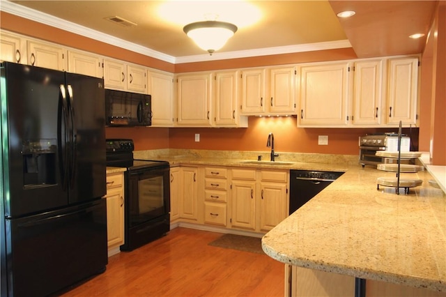 104 Victoria Dr, North Strabane, PA 15317 - kitchen featuring black appliances, light stone countertops, ornamental molding, light wood-style floors, and recessed lighting