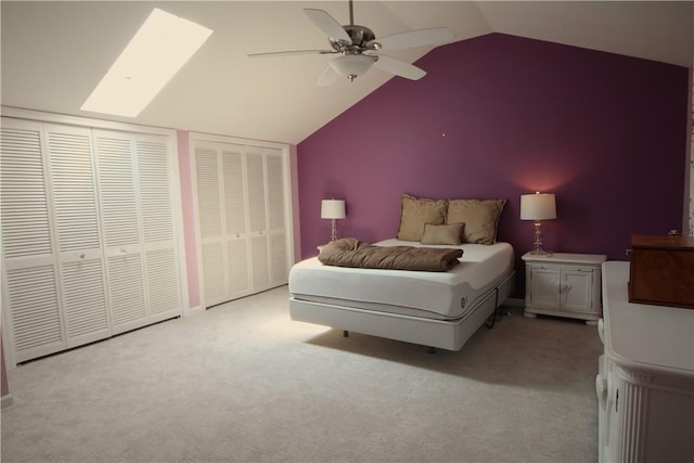 104 Victoria Dr, North Strabane, PA 15317 - carpeted bedroom featuring two closets, a skylight, lofted ceiling, and a ceiling fan