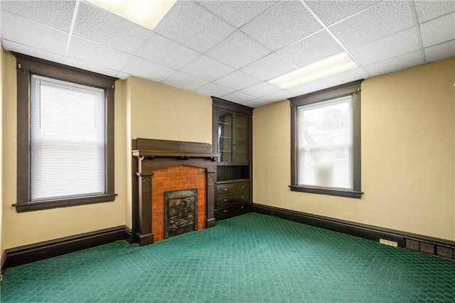408 Lydia St, Carnegie, PA 15106 - unfurnished living room with carpet flooring, a fireplace, plenty of natural light, and a drop ceiling