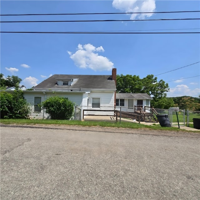 76 Foch Cir, Nemacolin, PA 15351 - view of front of property featuring a chimney and a gate
