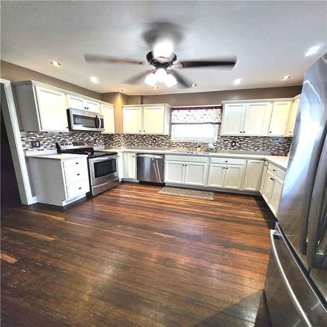 76 Foch Cir, Nemacolin, PA 15351 - kitchen featuring appliances with stainless steel finishes, a ceiling fan, backsplash, and dark wood finished floors