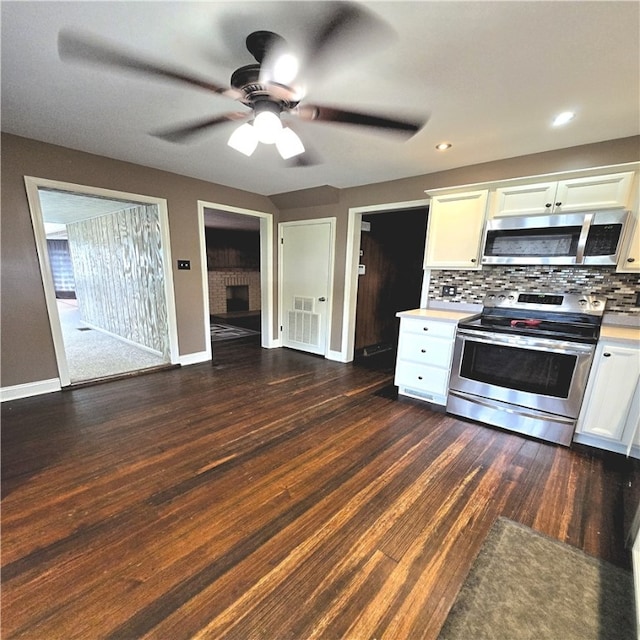 76 Foch Cir, Nemacolin, PA 15351 - kitchen featuring stainless steel appliances, a ceiling fan, light countertops, white cabinets, and backsplash