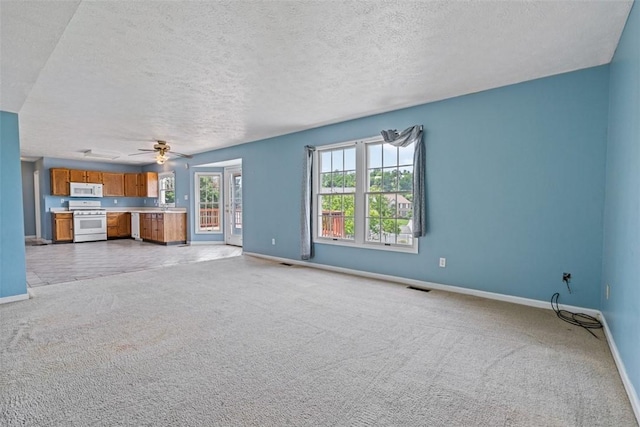 1445 Bristol Dr, South Park, PA 15129 - unfurnished living room featuring light carpet, a textured ceiling, and ceiling fan
