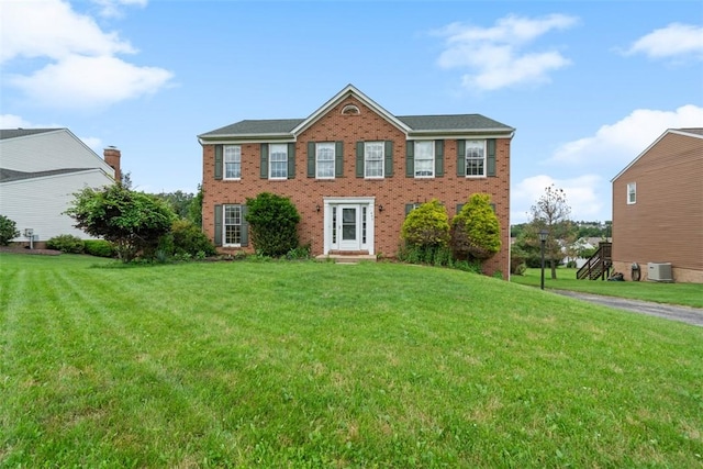 1445 Bristol Dr, South Park, PA 15129 - colonial-style house featuring a front yard and brick siding