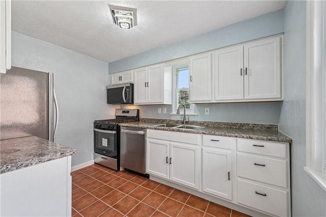 451 Charlotte Dr, Baldwin Boro, PA 15236 - kitchen featuring appliances with stainless steel finishes, white cabinets, and dark tile patterned floors