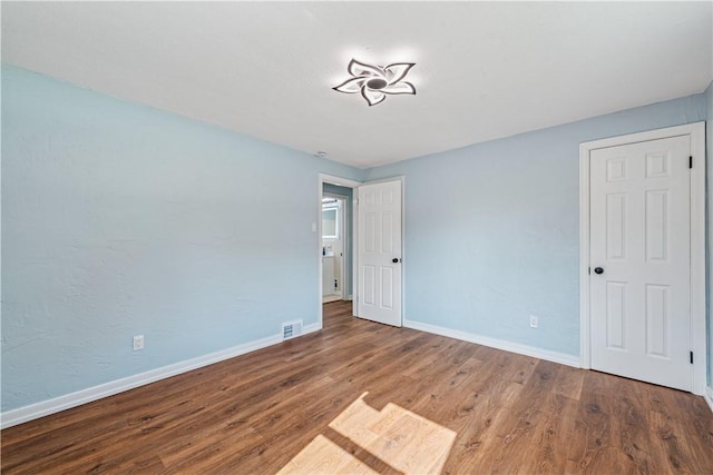 451 Charlotte Dr, Baldwin Boro, PA 15236 - unfurnished bedroom featuring wood finished floors and baseboards