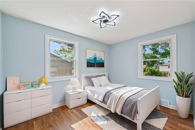 451 Charlotte Dr, Baldwin Boro, PA 15236 - bedroom with multiple windows and wood finished floors