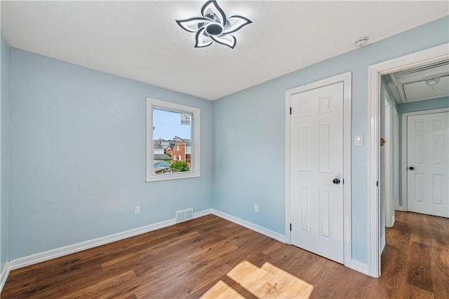 451 Charlotte Dr, Baldwin Boro, PA 15236 - unfurnished bedroom featuring attic access and wood finished floors