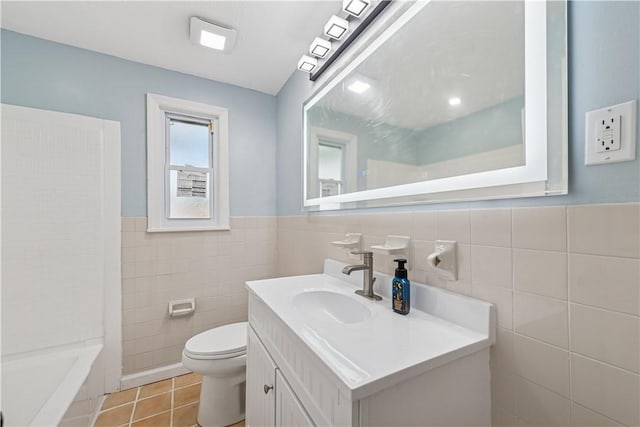 451 Charlotte Dr, Baldwin Boro, PA 15236 - bathroom featuring tile walls, vanity, tile patterned flooring, a bath, and wainscoting