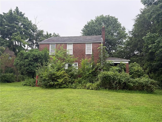 103 Belmont Rd, Twp Of But Ne, PA 16001 - view of side of property featuring a chimney, a lawn, and brick siding
