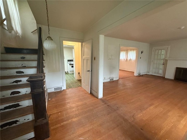 103 Belmont Rd, Twp Of But Ne, PA 16001 - unfurnished living room with light wood finished floors and stairs