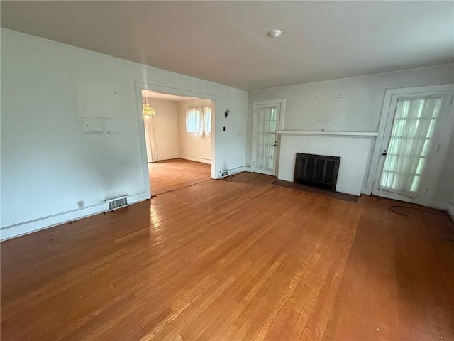 103 Belmont Rd, Twp Of But Ne, PA 16001 - unfurnished living room featuring light wood finished floors and a fireplace with flush hearth