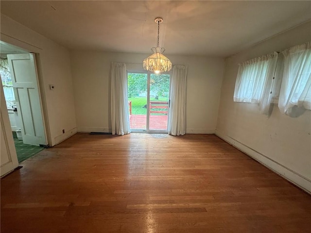 103 Belmont Rd, Twp Of But Ne, PA 16001 - unfurnished dining area featuring a chandelier and light wood-type flooring