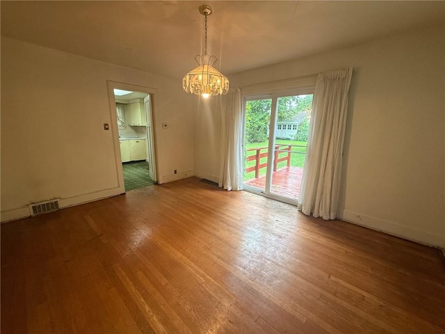 103 Belmont Rd, Twp Of But Ne, PA 16001 - empty room featuring light wood finished floors and a chandelier
