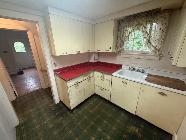 103 Belmont Rd, Twp Of But Ne, PA 16001 - kitchen with dark flooring and cream cabinetry