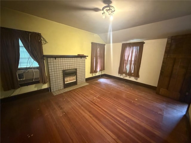 103 Belmont Rd, Twp Of But Ne, PA 16001 - unfurnished living room with dark wood finished floors, lofted ceiling, a tile fireplace, and cooling unit