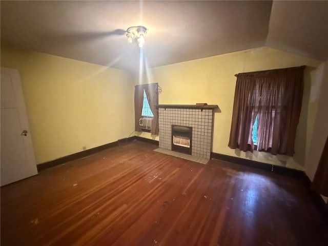 103 Belmont Rd, Twp Of But Ne, PA 16001 - unfurnished living room with wood finished floors, a tiled fireplace, vaulted ceiling, and cooling unit