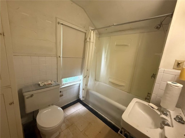 103 Belmont Rd, Twp Of But Ne, PA 16001 - full bathroom featuring tile walls, tile patterned floors, shower / bath combination with curtain, a wainscoted wall, and lofted ceiling