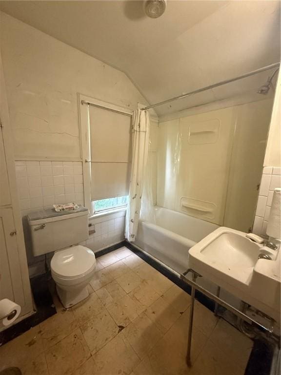 103 Belmont Rd, Twp Of But Ne, PA 16001 - full bathroom with shower / tub combo, tile walls, vaulted ceiling, tile patterned floors, and a wainscoted wall