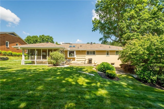 2633 Cedarvue Dr, Saint Clair, PA 15241 - back of house with a lawn, a patio, and a sunroom