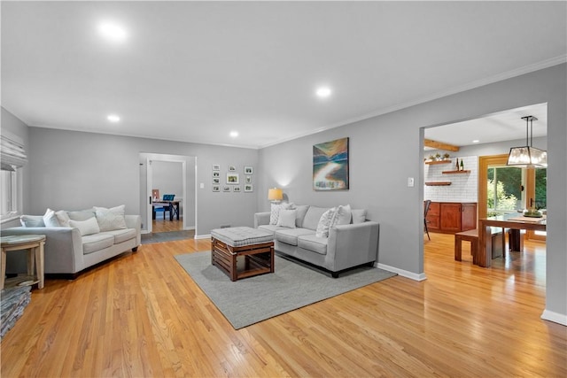 2633 Cedarvue Dr, Saint Clair, PA 15241 - living area featuring light wood-style flooring, recessed lighting, and crown molding