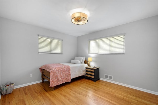 2633 Cedarvue Dr, Saint Clair, PA 15241 - bedroom featuring multiple windows and light wood-style floors