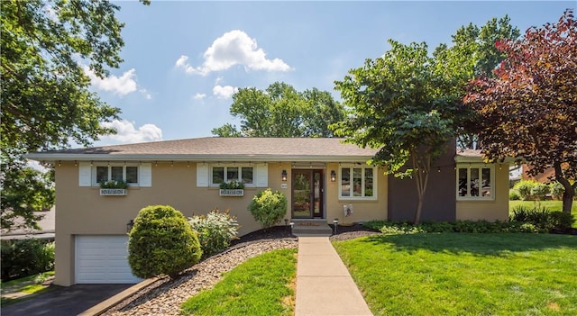 2633 Cedarvue Dr, Saint Clair, PA 15241 - view of front of house featuring an attached garage, a front lawn, and asphalt driveway