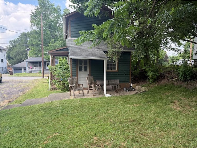 240 2nd Ave, Sharon, PA 16146 - back of property with a yard and roof with shingles