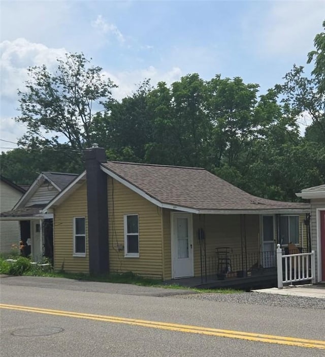 417 Valley St, Mcdonald, PA 15057 - view of front of property with covered porch, roof with shingles, and a chimney