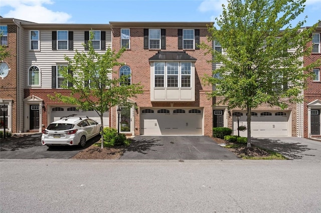 1004 Pointe View Dr, Adams Twp, PA 16046 - view of property with driveway, brick siding, and a garage
