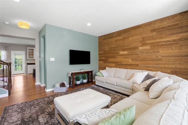 1004 Pointe View Dr, Adams Twp, PA 16046 - living area with wooden walls, wood finished floors, an accent wall, and recessed lighting