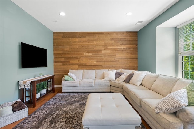 1004 Pointe View Dr, Adams Twp, PA 16046 - living room featuring an accent wall, wooden walls, recessed lighting, and wood finished floors
