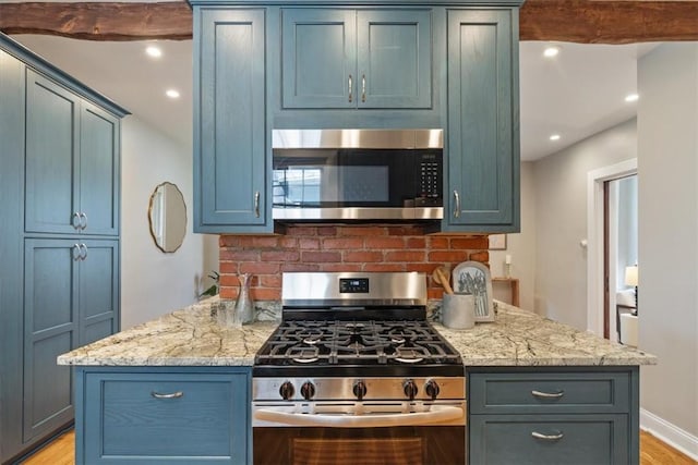 248 Berringer Pl, Ben Avon, PA 15202 - kitchen with stainless steel appliances, light wood-style flooring, light stone countertops, recessed lighting, and blue cabinetry