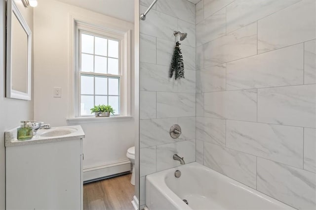 248 Berringer Pl, Ben Avon, PA 15202 - bathroom featuring baseboard heating, vanity, washtub / shower combination, and wood finished floors