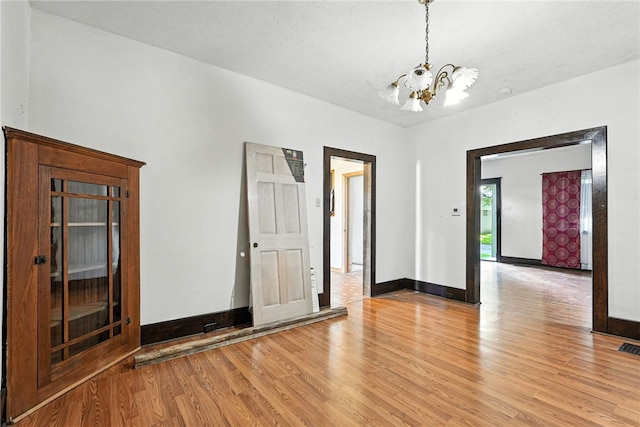419 8th Ave, Patterson Heights, PA 15010 - unfurnished room with a chandelier and light wood finished floors