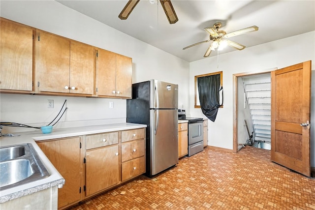 419 8th Ave, Patterson Heights, PA 15010 - kitchen featuring stainless steel appliances, a ceiling fan, light countertops, and light floors