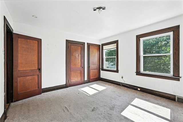 419 8th Ave, Patterson Heights, PA 15010 - unfurnished bedroom featuring multiple windows and carpet flooring