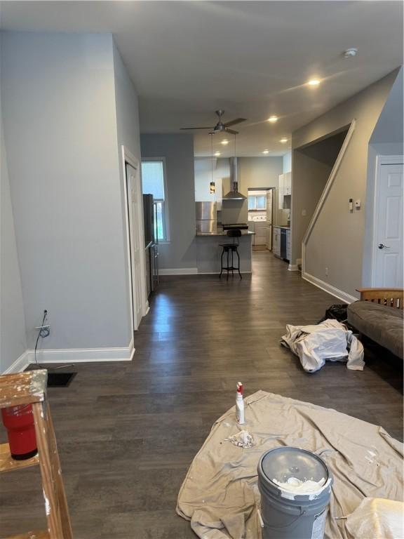 2411 Sarah St, South Side, PA 15203 - living area featuring a ceiling fan and dark wood finished floors