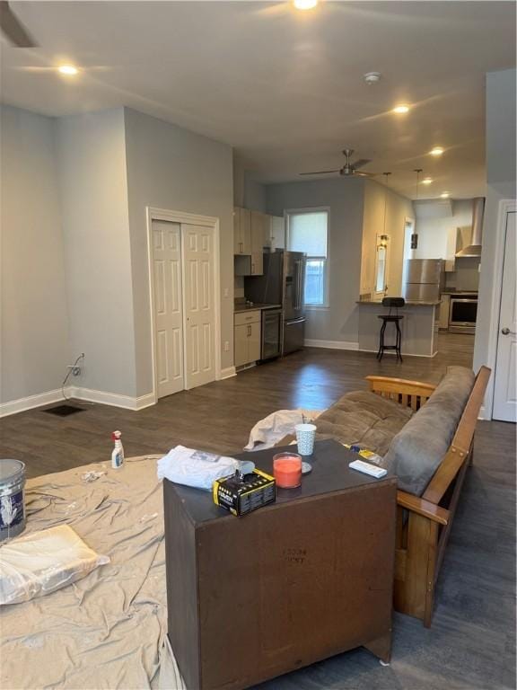 2411 Sarah St, South Side, PA 15203 - living area featuring ceiling fan and dark wood-style flooring