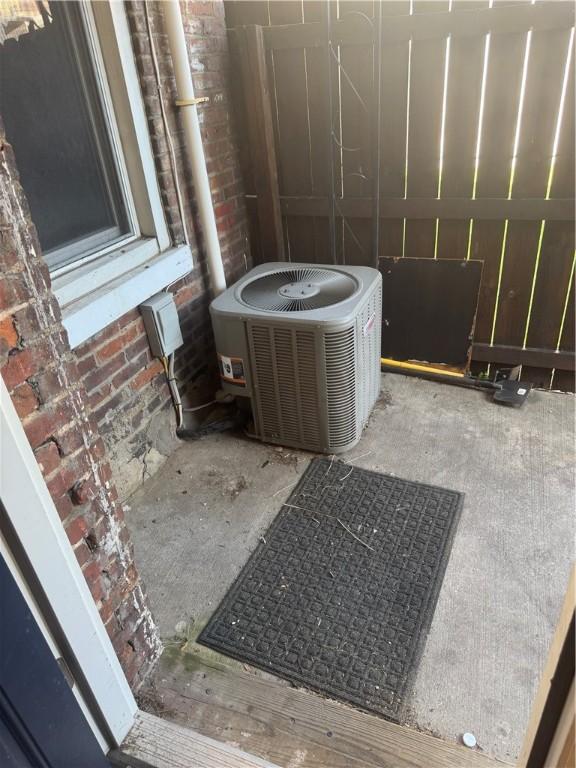 2411 Sarah St, South Side, PA 15203 - exterior view of a cooling unit and brick siding