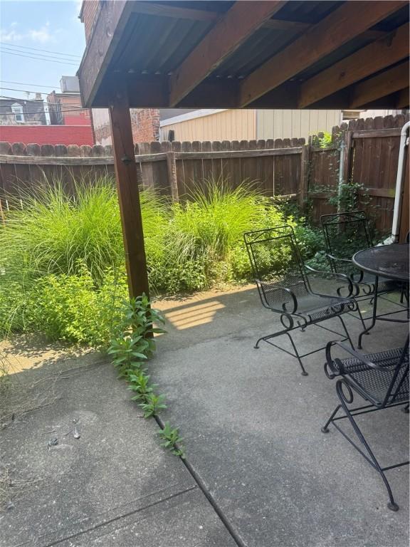 2411 Sarah St, South Side, PA 15203 - fenced backyard featuring a patio area