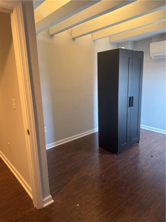 2411 Sarah St, South Side, PA 15203 - spare room with dark wood-style floors and a wall unit AC