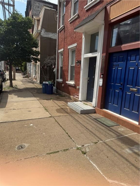 2411 Sarah St, South Side, PA 15203 - view of exterior entry featuring brick siding