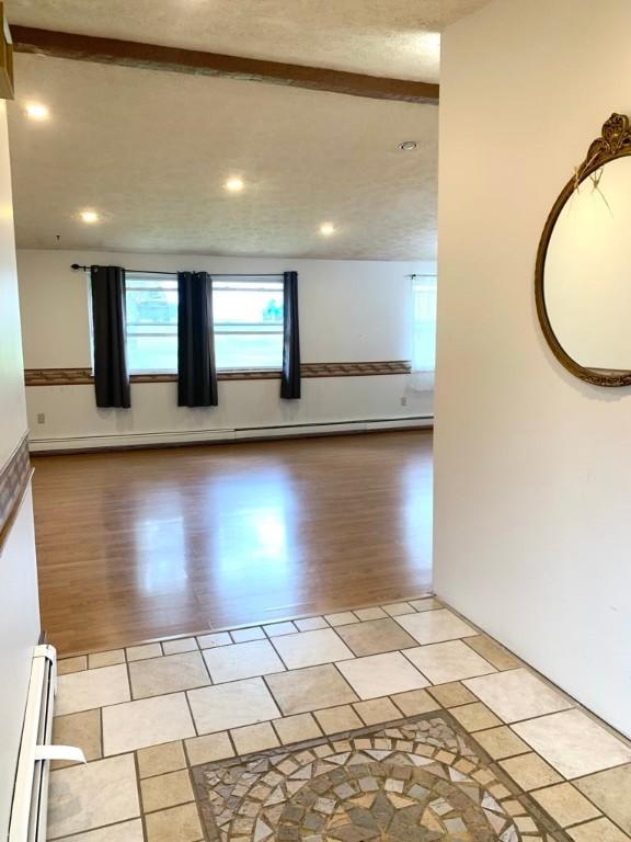 840 Lansberry Ct, Somerset Boro, PA 15501 - empty room with light wood-type flooring, baseboard heating, and recessed lighting