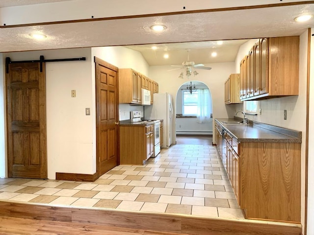 840 Lansberry Ct, Somerset Boro, PA 15501 - kitchen featuring white appliances, dark countertops, ceiling fan, a barn door, and recessed lighting